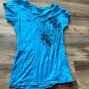 Teal & black Tee shirt.